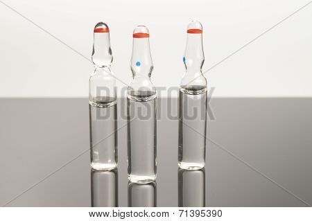 Clear Medical Ampules Isolated On Black Background