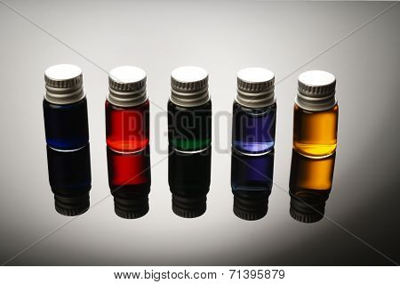 Colorful Vials Isolated On Black Background