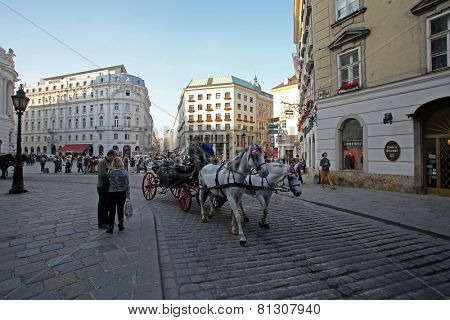 VIENNA, AUSTRIA - OCTOBER 10: Traditional old-fashioned fiacres at Michaelerplatz near Hofburg of Vienna, Austria on October 10, 2014.