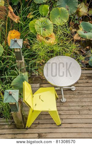 Single chair and table on deck