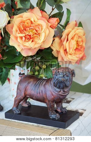 Dog A Figurine, Against Flowers