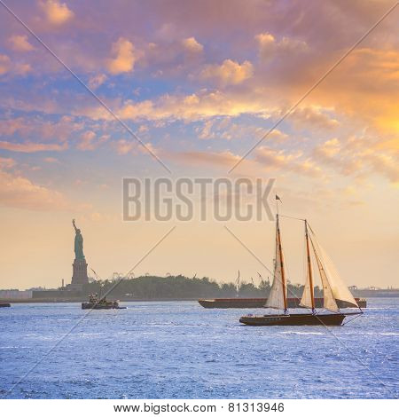 New York sailboat sunset and Statue of Liberty from Manhattan US