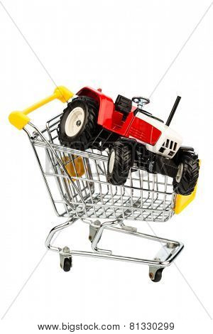 a tractor into cart as a symbol for the purchase of a new agricultural equipment