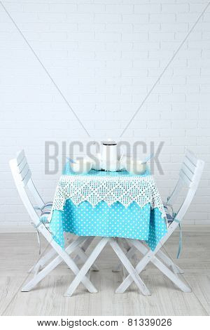 Wooden chairs and table in cozy kitchen
