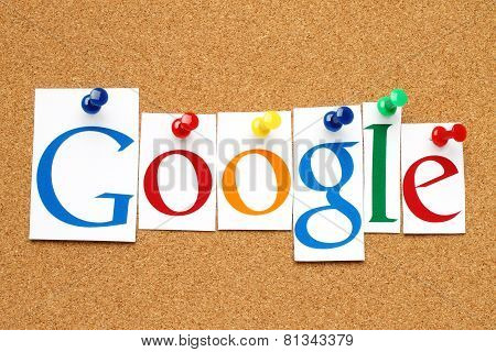 Google logotype printed on paper cut and pinned on cork bulletin