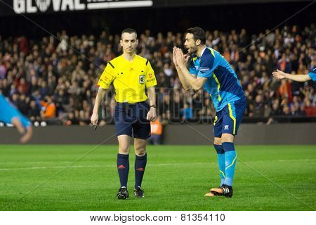 VALENCIA, SPAIN - JANUARY 25: Iborra (R) and referee Jaime Latre during Spanish League match between Valencia CF and Sevilla FC at Mestalla Stadium on January 25, 2015 in Valencia, Spain