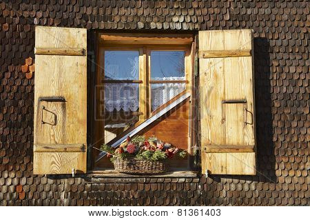 Exterior detail of the traditional Swiss chalet in Rougemont, Switzerland.