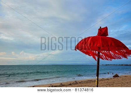 Red beach umbrella . Tropical paradise .