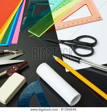 Desk covered with multiple stationery