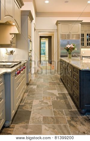 expensive kitchen with slate floors and mixed wood