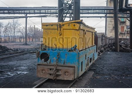 Train In National Colors With Trolleys In A Coal Mine. Donbass, Ukraine