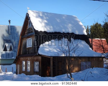 Village in winter sunny day