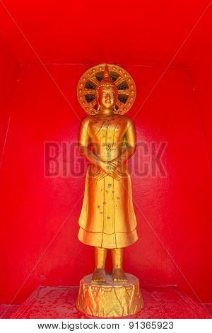 the standing gold buddha statue