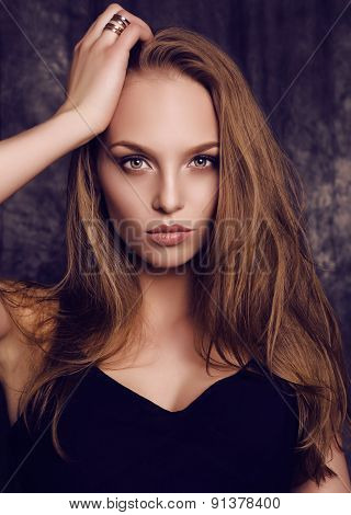 Potrait Of Beautiful Young Woman With Dark Hair And Green Eyes
