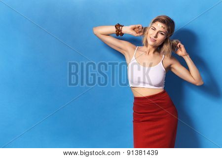 Beautiful Sexy Blonde Woman With Make Up In Red Skirt On Blue Background