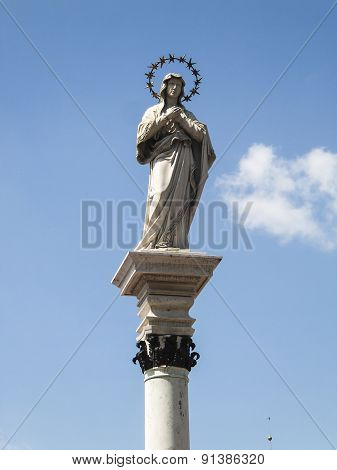 Statue Of Our Lady Of The Immaculate Conception In The Middle Of The Square In Front Of The Monaster