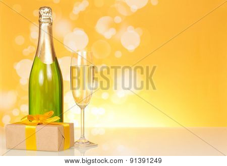 Bottle of champagne with glass
