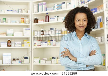 Female pharmacist working in UK pharmacy