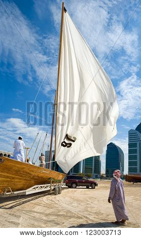 Abu Dahbi U.A.E. - February 22 2007: Preparation works of feluccas racing in the Marina Sporting Club.