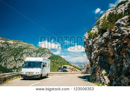 Verdon, France - June 29, 2015: White colour Hymer motorhome car on background of French mountain nature landscape. The Hymer AG is a one of largest manufacturers of motorhomes and caravans in Europe.