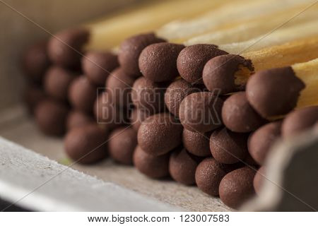 white matchbox with matches on the table