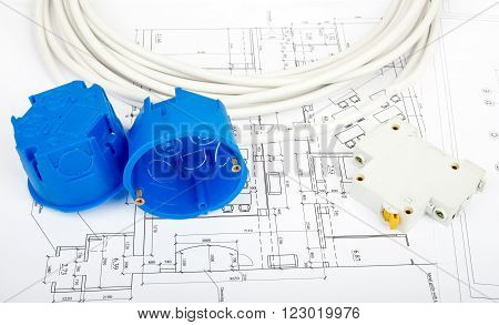 Architecture plan and rolls of blueprints with cabel and blue plastic covers. Building concept