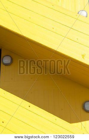 Modern yellow stairway exterior to a carpark