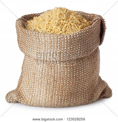 Bulgur or couscous in burlap bag isolated on white background