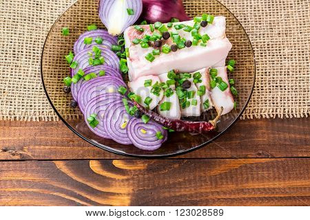 Fresh Pork Fat, With Red Hot Chili Peppers, Green And Purple Onions And  Peas Allspice Beautifully L