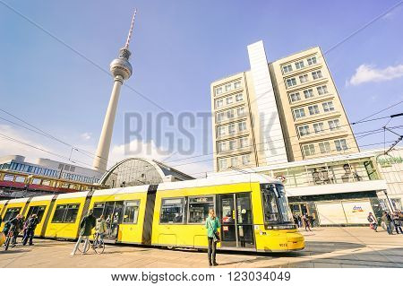 BERLIN GERMANY - 4 MARCH 2016: metro tram bus at Alexanderplatz in central Mitte district of european capital city with televison tower known as 