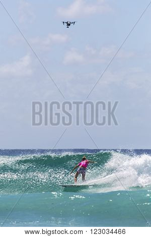 GOLD COAST, AUSTRALIA - MARCH 12 2016: Stephanie Gilmore (AUS) competing in the Roxy Pro at Snapper Rocks Coolangatta. WSL Drone hovering overhead