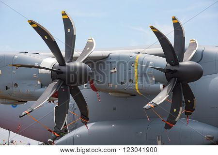 Singapore - February 17 2016: Engines and propellers of an Airbus A400M on display during Singapore Airshow at Changi Exhibition Centre in Singapore.