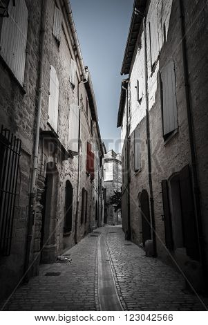Narrow street in France with typical buildings