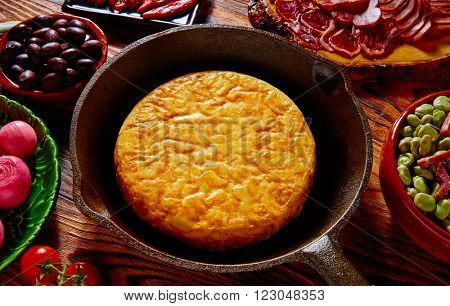 Tapas tortilla de patata potatoes omelette in a pan from Spain