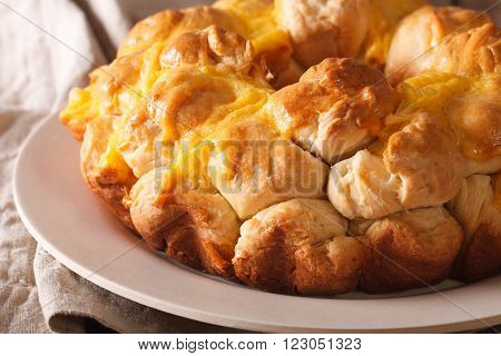 Homemade monkey bread with cheese macro on a plate. horizontal