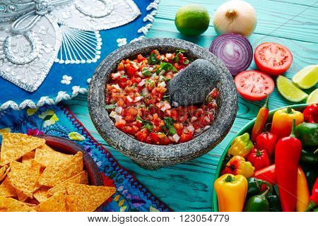 Pico de Gallo sauce from Mexico with tomato cilantro and onion in molcajete