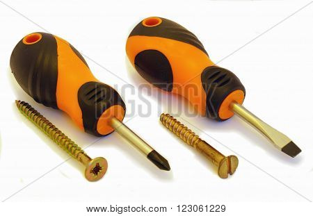 Two screwdrivers and two screws on a white background