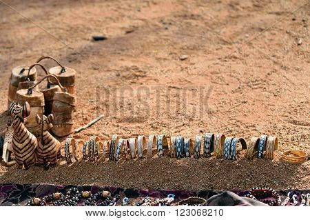 Primitive hand made souvenirs - african style shown on the craft market in local Himba tribe village. Namibia Africa
