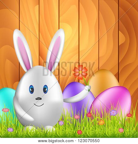Easter bunny egg and colorful eggs on spring meadow. Easter background with space for text. Vector illustration