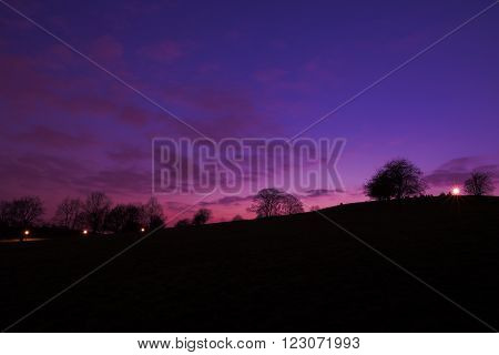 Purple sunset at Primrose Hill Park in London England UK