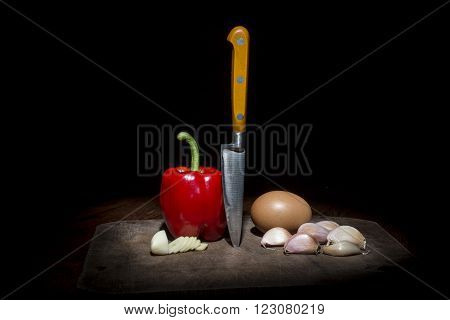Knife, Mortar, Egg, Pepper And Garlic