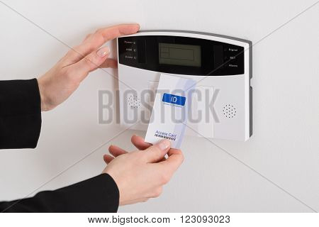 Close-up Of Woman Hand Holding Keycard To Open Door
