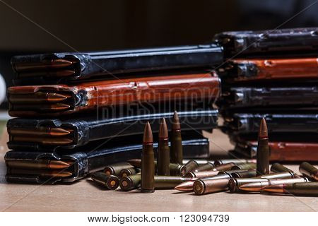 7.62 ammo for machine guns with loaded magazines on table