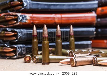 7.62 ammo for machine guns with loaded magazines on table