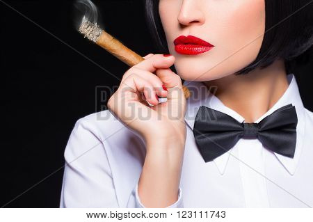 Gangster woman with cigar smoking white shirt and tuxedo