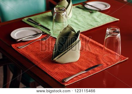 Dining Table Setting with Textile Napkin and Crockery