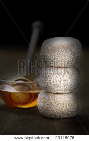 French fresh goat cheese called crottin de chavignol and honey