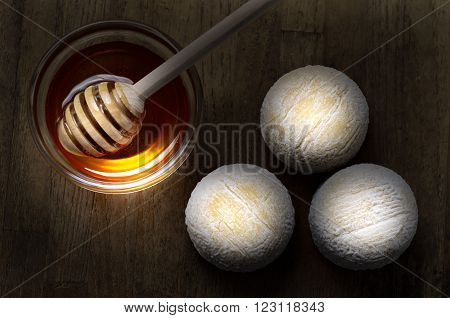 French fresh goat cheese called crottin de chavignol and honey