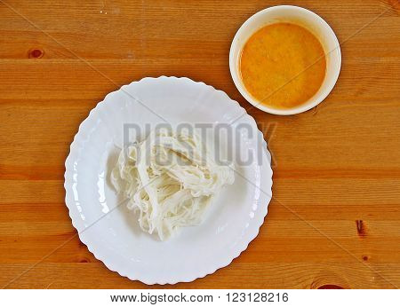 Thai curry dish mainly made from fish and coconut milk served with rice vermicelli