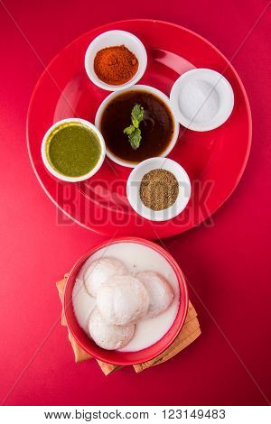 dahi vada or dahi vade also known as Curd Vadai in South India, a popular snack famous all over India prepared by soaking lentil vadas in thick dahi or yogurt, topped with spicy & sweet chutney etc
